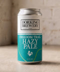Dorking Brewery Hazy Pale Ale can on a wooden surface with a rustic background