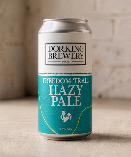 Dorking Brewery Hazy Pale Ale can on a wooden surface with a rustic background