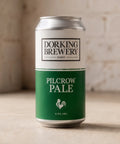 Dorking Brewery Pilcrow Pale beer can on a wooden surface with a blurred background