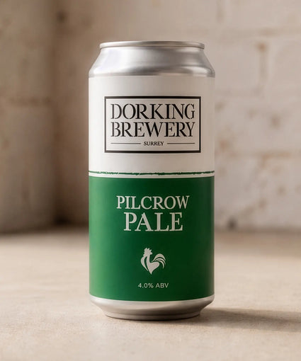 Dorking Brewery Pilcrow Pale beer can on a wooden surface with a blurred background