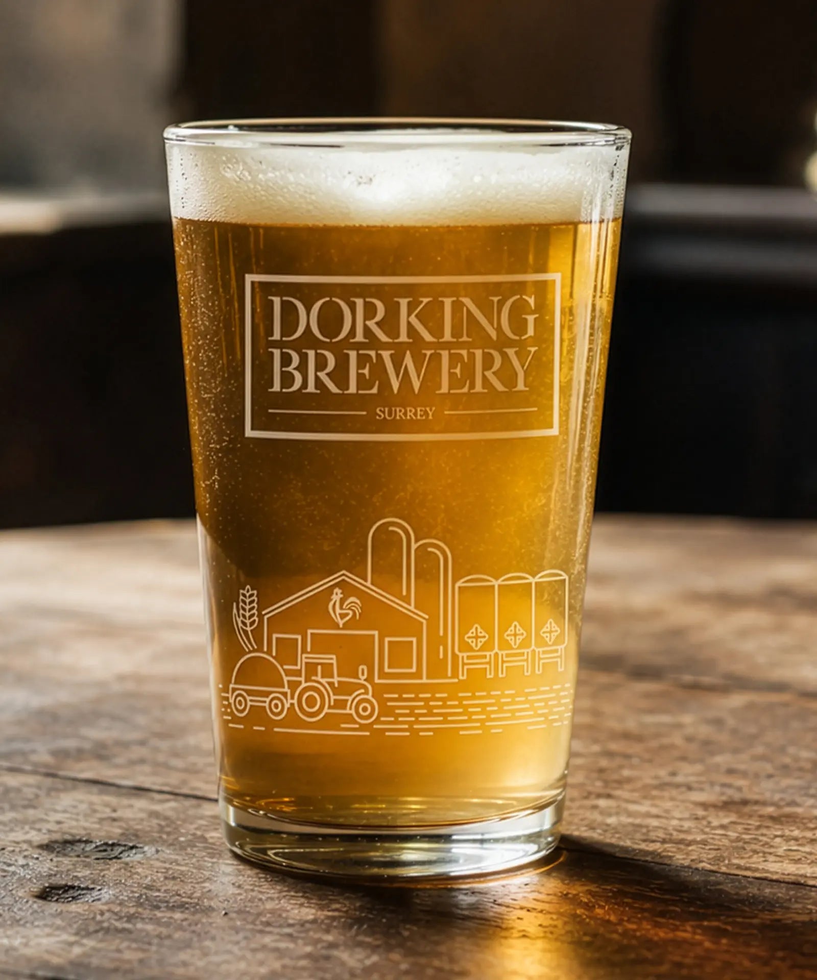 Pint glass of beer from Dorking Brewery on a wooden surface