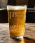 Pint glass of beer from Dorking Brewery on a wooden surface