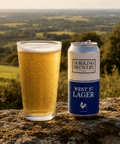 Dorking Brewery West St Lager can and glass of beer with a scenic background