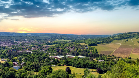 A panoramic view over the Surrey Hills and Dorking at dusk.